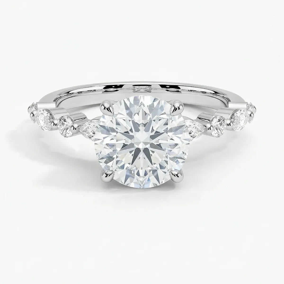 Side stone engagement ring setting